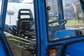 Blue tractor detail close up cabin view Royalty Free Stock Photo