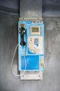 Blue vintage public pay phone Royalty Free Stock Photo