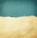 Blue vintage torn paper over grunge paper texture. Royalty Free Stock Photo