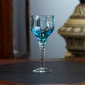 Blue vintage wine glass close-up. antique wine glass Royalty Free Stock Photo
