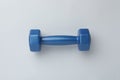 Blue vinyl dumbbell on light background, top view