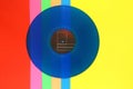 Blue Vinyl record on a colorful background. Retro style. Top view.