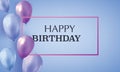 Blue and violet realistic balloons filled with helium on blue background with text happy birthday. Invitation card.