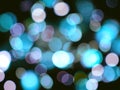 blue and violet bright glowing blurred lights abstract on a black night background Royalty Free Stock Photo