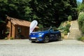 Blue Volkswagen electric car at a testing event in Arad, Romania