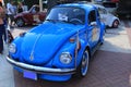 Blue Volkswagen vehicle in the parking lot