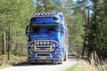 Blue Volvo FH16 750 Timber Truck on Forest Road
