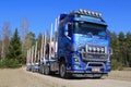 Blue Volvo FH16 750 Timber Truck on Rural Road