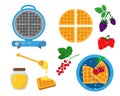 Blue waffle maker with waffles, berries and honey Royalty Free Stock Photo