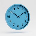 Blue wall clock for classroom floating in mid air, on solid white background Royalty Free Stock Photo