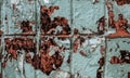 Blue wall tiles texture background with old peeling paint, spots and scraps of ads Royalty Free Stock Photo