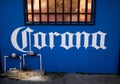 Blue wall with a white Corona word painted on it in Playa del Carmen, Mexico