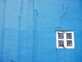 Blue wall with white window frame Royalty Free Stock Photo