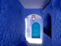 Blue-walled passageway with door, Chefchaouen, the blue city, Morocco