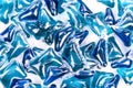 Blue washing capsules on white background, close up