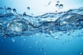 Blue water background adorned with bubbles and glistening water surface Royalty Free Stock Photo
