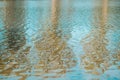 blue water background, reflection of trees. Waves. Ripples