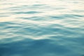 Blue water background with ripples, sea, ocean wave low angle view. Close-up Nature background. Hard focus with Royalty Free Stock Photo