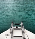 Blue water and boat ladder