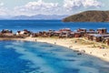 Blue water and coast of Titicaca lake, boats, walking people and Royalty Free Stock Photo