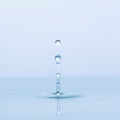 Blue water drop falling down Royalty Free Stock Photo