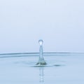 Blue water drop falling down Royalty Free Stock Photo