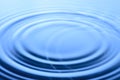 Blue water drop and splash background Royalty Free Stock Photo