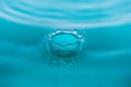 Water drop splash crown in blue tones Royalty Free Stock Photo