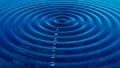 Blue water drops ripples. Royalty Free Stock Photo