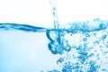 Blue water flowing along with white background bubbles. Royalty Free Stock Photo