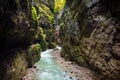 Blue water flowing in the Partnach Gorge or Partnachklamm, incised by a mountain stream in the Reintal valley near the town of Gar