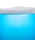 Blue water with foam or soap Royalty Free Stock Photo