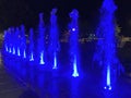 Blue Water Fountain Light Display at Night Royalty Free Stock Photo