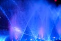 Blue water fountain light magic festival fair. park light show in evening night Royalty Free Stock Photo