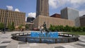 Blue water fountain with Runner Statue at Kiener Plaza Park in St. Louis - ST. LOUIS, UNITED STATES - JUNE 19, 2019