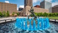 Blue water fountain with Runner Statue at Kiener Plaza Park in St. Louis - ST. LOUIS, USA - JUNE 19, 2019