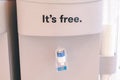 Blue water gallon with word `It`s free,Drink up,Stress?`on electric water cooler