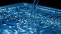 Blue Water Ripples with Pouring Stream Closeup Royalty Free Stock Photo