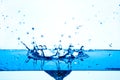 Blue water splashing on white background. Royalty Free Stock Photo