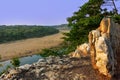 Blue water from the stone altar on the high bank of the river surrounded by Green trees is beneath the blue sky in Indian village Royalty Free Stock Photo