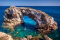 Blue water and sunny day at the Beautiful nature wonder in Palma de Mallorca. Es Pontas natural rock formations in Palma de