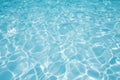 Blue water surface in swimming pool witn sun reflection Royalty Free Stock Photo