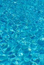 Blue water in swimming pool background. Ripple Water in swimming pool with sun reflection. Blue swimming pool rippled water detail Royalty Free Stock Photo