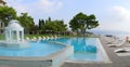 Blue water swimming pool at a hotel by the Saronic Gulf, Isthmia, Greece Royalty Free Stock Photo