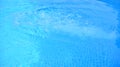 Blue water in swimming pool with sun reflection. Royalty Free Stock Photo