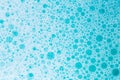 Blue water with white foam bubbles.Cleanliness and hygiene.blue soap bubbles background. Foam Water Soap Suds.Texture Royalty Free Stock Photo