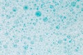 .Blue water with white foam bubbles.Cleanliness and hygiene background.foam bubbles. Foam Soap Suds.Texture Foam Close Royalty Free Stock Photo