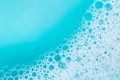 Blue water with white foam bubbles.Foam Water Soap Suds.Texture Foam .foam bubbles. blue soap bubbles background. Royalty Free Stock Photo