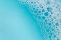 Blue water with white foam bubbles.Foam Water Soap Suds.Texture Foam . blue soap bubbles background. Royalty Free Stock Photo