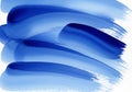 Blue watercolor brush strokes create an abstract pattern on a white background. The Royalty Free Stock Photo